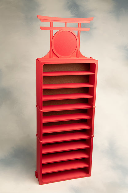 Red 11 belt display with a Torii Gate Topper on a gray background