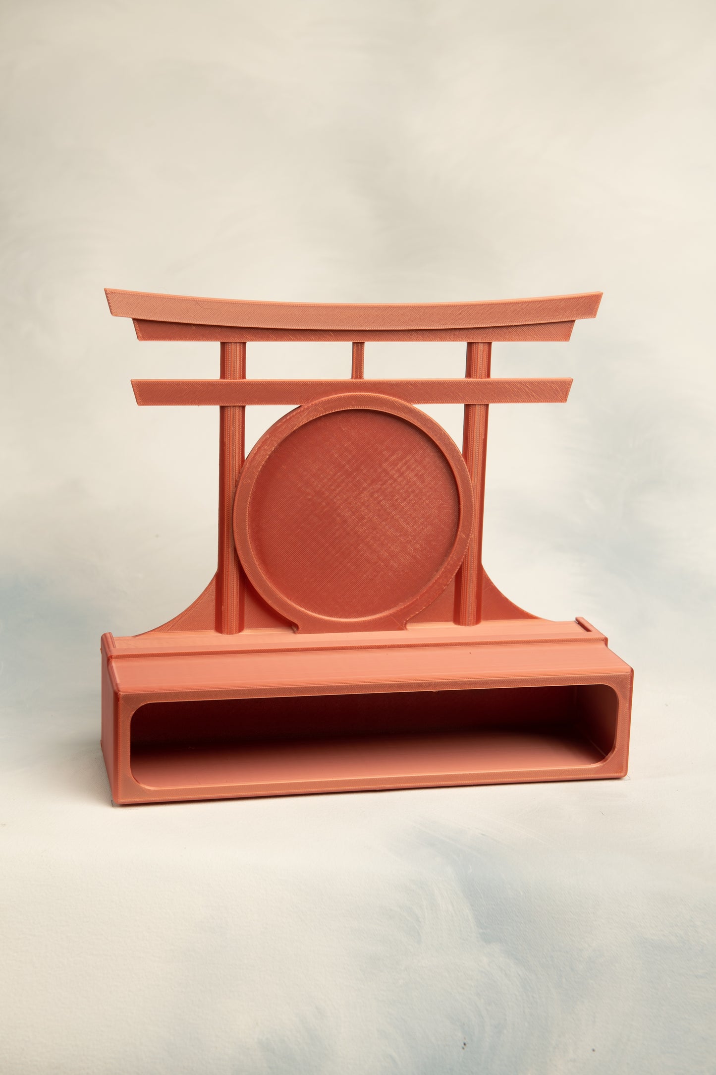 Red Copper 1 belt display case with a  Torii gate topper on a light gray background