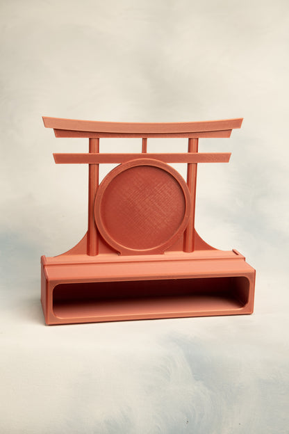 Red Copper 1 belt display case with a  Torii gate topper on a light gray background