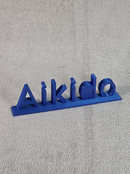 Blue 'Aikido' branding on a textured gray background