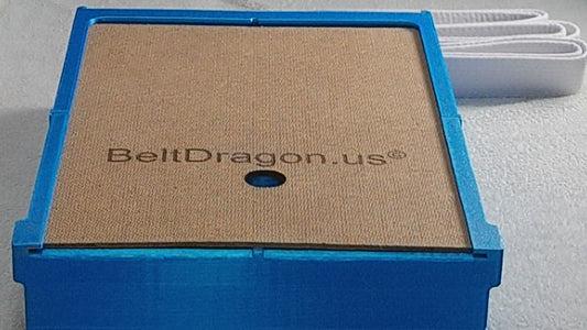 Video displaying how to load a belt into case by sliding off the back cover, inserting the tail of a belt after folding belt in half and weaving belt back and forth and finally, replacing the back cover by sliding the back into slot past the locking tab